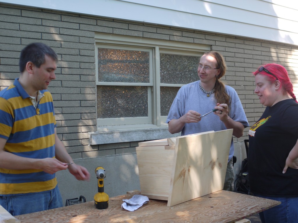 Tom Nagy (left) helps out at one of the first Little Libraries of KW KW Community Builds.