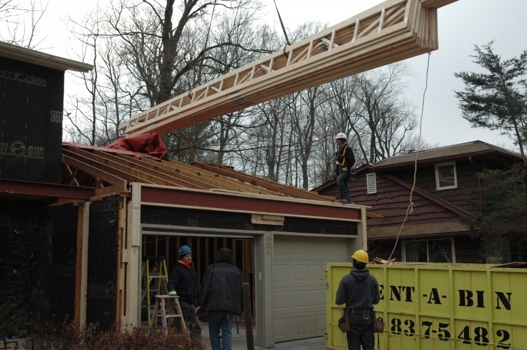 and finally our garage roof trusses being hoisted into place.